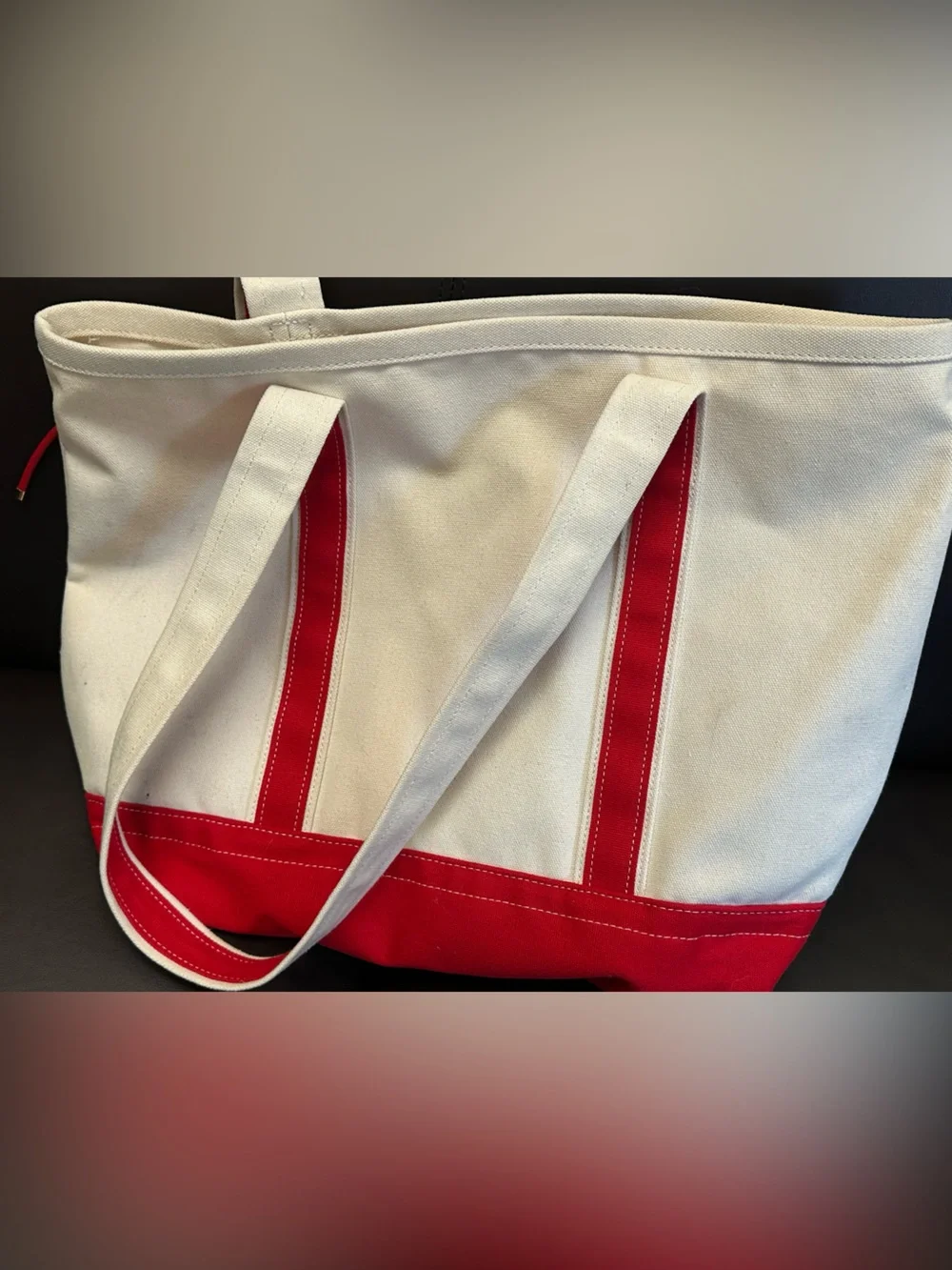 Cream Canvas Tote with Red Trim and Decorative Charm